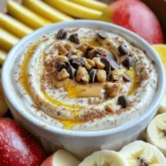 - 1 cup plain Greek yogurt - 1/2 cup natural peanut butter - 2 tablespoons honey or maple syrup - 1 teaspoon vanilla extract - 1/2 teaspoon cinnamon - A pinch of sea salt - Optional: Chopped nuts or dark chocolate chips for topping I love using plain Greek yogurt in this dip. It packs a punch of protein and gives a creamy base. Natural peanut butter adds a rich, nutty flavor. Honey or maple syrup adds sweetness. You can choose either based on your taste. Vanilla extract brightens the flavor. A touch of cinnamon adds warmth. Just a pinch of sea salt balances everything. Optional toppings, like chopped nuts or dark chocolate chips, add crunch and fun. You can mix and match these as you like. Each ingredient plays its part in making this dip tasty and satisfying. - Mixing the base ingredients Start by taking a mixing bowl. Add 1 cup of plain Greek yogurt and 1/2 cup of natural peanut butter. These two ingredients will give your dip a creamy base. Use a whisk or spoon to mix them well. - Adding sweeteners and spices Next, add 2 tablespoons of honey or maple syrup for sweetness. Then, pour in 1 teaspoon of vanilla extract and sprinkle 1/2 teaspoon of cinnamon. Lastly, add a pinch of sea salt. These flavors will enhance the dip’s taste. - Achieving the desired consistency Mix all the ingredients together until you have a smooth and thick dip. If it feels too thick, you can add a splash of milk to loosen it up. This step is key to making the dip easy to scoop. - Tips for adjusting sweetness After mixing, taste the dip. If you want it sweeter, add more honey or maple syrup. Mix again after adding. This way, you control the sweetness to fit your taste. - Ideal serving bowl presentation Transfer the dip into a nice serving bowl. For a fun touch, top it with chopped nuts or dark chocolate chips. This makes the dip look great and adds extra crunch. - Chilling time for optimal flavor To let the flavors blend, chill the dip in the fridge for at least 30 minutes. This waiting time makes a big difference in taste. Enjoy it with sliced fruits or whole grain crackers for dipping! - Alternative sweeteners: You can swap honey with agave syrup or stevia. Both options work well and can change the dip's taste just a bit. - Non-dairy yogurt options: If you want a dairy-free dip, try coconut yogurt or almond yogurt. They still give you a creamy base. - Nut butter alternatives: If you don't have peanut butter, almond butter or sunflower seed butter are great choices. They add their unique flavors and make the dip fun. - Suggestions for additional spices: You can add nutmeg or ginger for a warm touch. A tiny bit of cocoa powder can also make it richer. - Ideas for flavor combinations: Mix in some mashed bananas for a fruity twist. You could also add a spoonful of jam to create a sweet surprise. {{image_2}} You can switch up the nut butter in this dip. Almond butter works great, too. It gives a rich, nutty taste. To make an almond butter dip, just swap it for the peanut butter. The rest of the recipe stays the same. Cashew butter is another tasty option. It has a smooth and creamy texture. Use it in place of the peanut butter for a different flavor. This change adds a unique twist to the dip while still keeping it high in protein. Want to mix things up? Try making a chocolate peanut butter dip. Just add two tablespoons of cocoa powder to the mix. It gives a rich chocolate taste that pairs well with fruit. This variation is perfect for chocolate lovers. You can also create fruit-infused options. Mix in finely chopped fruits like strawberries or bananas. This adds a fresh taste and a colorful look. Try adding one cup of your favorite fruit to the dip for a fun twist. To store leftovers, place the dip in an airtight container. This keeps it fresh. You can also use plastic wrap. Make sure it covers the dip well. The expected shelf life in the fridge is about 3 to 5 days. Always check for any off smells or discoloration before eating. Yes, you can freeze the dip! To do this, transfer the dip to a freezer-safe container. Leave some space at the top for expansion. The dip can last up to 2 months in the freezer. For thawing, move it to the fridge overnight. Stir it well before serving to get the right texture again. This dip has a high protein content. One cup of plain Greek yogurt has about 20 grams of protein. Adding peanut butter boosts it further. Half a cup of peanut butter adds around 14 grams. In total, this dip packs about 34 grams of protein. Yes, you can make this dip vegan. To do this, swap the Greek yogurt for a dairy-free yogurt. Look for a plant-based yogurt that has a creamy texture. Use maple syrup instead of honey. This keeps the flavor while making it vegan-friendly. Serving this dip at a party is easy and fun. Use a colorful bowl for a nice look. Offer a variety of dippers like sliced fruits, whole grain crackers, or pretzel sticks. You can even make fun fruit skewers. This adds a nice touch and makes it easy for guests to dip. Many fruits go well with this dip. Apples and bananas are classics. Strawberries and pears also taste great. You can even try it with sliced peaches or grapes. Each fruit adds its own flavor and texture to the dip. Yes, this dip is great for meal prep. You can make it ahead of time and store it in the fridge. It stays fresh for about 3-5 days. Just keep it in an airtight container. This way, you always have a healthy snack ready to go. This blog post covered how to make a tasty Greek yogurt dip. We looked at the ingredients, including Greek yogurt and peanut butter, and the steps to prepare it. I shared tips for ingredient swaps and flavor variations. Proper storage methods help keep your dip fresh. In the end, this dip is simple and fun. You can adjust it to your taste and needs. Enjoy making it for yourself or a party!