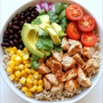 - 1 lb boneless, skinless chicken breast - 2 cups cooked brown rice - 1 can black beans - 1 cup corn kernels - 1 red bell pepper - 1 avocado - 1 cup cherry tomatoes - 1/2 cup red onion - 1 teaspoon cumin - 1 teaspoon smoked paprika - 1 tablespoon olive oil - 2 tablespoons lime juice - Salt and pepper to taste - Fresh cilantro for garnish The Chicken Burrito Bowl comes together with simple yet tasty ingredients. You need chicken, brown rice, and some colorful veggies to make this dish shine. Start with 1 lb of boneless, skinless chicken breast. This lean meat cooks quickly and offers great protein. Next, grab 2 cups of cooked brown rice. This adds a hearty base to your bowl. It’s also full of fiber. You’ll need 1 can of black beans, which adds texture and protein. Rinse and drain them well. For a sweet crunch, use 1 cup of corn kernels. Fresh or frozen works just fine. A red bell pepper brings a sweet flavor and vibrant color. Dice it for easy mixing. Don’t forget 1 avocado! It adds creaminess and healthy fats. Dice it right before serving to keep it fresh. 1 cup of cherry tomatoes adds a juicy burst. Halve them for easy eating. Lastly, add 1/2 cup of red onion. This gives a nice sharpness to your dish. Now for seasonings. Use 1 teaspoon of cumin and 1 teaspoon of smoked paprika. These spices give the chicken a warm, rich flavor. You’ll also need 1 tablespoon of olive oil. This helps cook the chicken and adds healthy fat. Add 2 tablespoons of lime juice for zesty brightness. Don’t forget salt and pepper to taste. Finally, top it all with fresh cilantro for a pop of color and flavor. With these ingredients, you can create a tasty and colorful Chicken Burrito Bowl that everyone will love! - First, take your diced chicken breast. - In a large bowl, season it with cumin, smoked paprika, salt, and pepper. - Make sure each piece gets good flavor. - Next, heat olive oil in a large skillet over medium heat. - Once the oil is hot, add the seasoned chicken. - Cook the chicken for about 6-8 minutes. - Stir it often until it is fully cooked with no pink inside. - Remove the skillet from heat. - In a separate bowl, combine the cooked brown rice, black beans, corn, and diced red bell pepper. - Add the halved cherry tomatoes and finely chopped red onion. - Toss everything gently to mix well. - Squeeze lime juice over the mixture for extra flavor. - Stir again to make sure the lime juice is mixed in. - Grab serving bowls and start to divide the rice and bean mixture into them. - Top each bowl with a generous portion of the cooked chicken. - Finally, garnish each bowl with diced avocado and fresh cilantro. - This adds freshness and a pop of color. - Serve your delicious chicken burrito bowl right away! - Make sure your chicken is fully cooked. Cook it until no pink shows inside. - Use fresh ingredients to boost flavor. Fresh veggies bring life to your bowl. - Arrange your ingredients attractively. Layering adds height and interest to the dish. - Use colorful toppings for visual appeal. Bright colors make the meal inviting. - Prepare your ingredients in advance. Chop veggies and cook the chicken ahead of time. - Store components separately for freshness. This keeps each part tasting great longer. {{image_2}} You can easily make this dish vegetarian. Simply substitute the chicken with grilled vegetables. Zucchini, bell peppers, and mushrooms work well. Another option is to use tofu or tempeh as protein. Both options will keep the dish hearty and satisfying. If you want to change things up, swap brown rice for quinoa or cauliflower rice. Quinoa adds a nutty flavor and more protein. Cauliflower rice is a great low-carb choice. You can also use different beans or legumes. Pinto beans or chickpeas bring new tastes and textures to the bowl. Feel free to add different toppings to your burrito bowl. Cheese, sour cream, or hot sauce can enhance the flavor. You can also experiment with seasonings for unique flavors. Try adding chili powder, garlic powder, or even a dash of lime zest to make it your own. You should store your chicken burrito bowl in airtight containers. This keeps it fresh. The bowl tastes best if eaten within 3-4 days. After that, it may lose its flavor and texture. Always check for any signs of spoilage before eating. To freeze, first separate the components. Place the chicken, rice, and veggies in different bags or containers. This helps keep the taste and texture better. When you want to eat it, take it out and thaw it in the fridge overnight. You can also use the microwave for quick thawing if needed. To reheat, use the oven or microwave. Bake in the oven at 350°F for about 15 minutes. This method keeps the chicken juicy. In the microwave, heat in small intervals. Stir between to warm evenly. If you want to freeze unassembled bowls, do so right after cooking. This keeps everything fresh and tasty. You can assemble them later when you are ready to eat. To add spice, you can use several ingredients. Here are some ideas: - Jalapeños: Dice fresh jalapeños and mix them in. - Hot Sauce: Drizzle your favorite hot sauce over the top. - Chili Powder: Add a teaspoon of chili powder to the chicken seasoning. - Spicy Salsa: Use a spicy salsa as a base or topping. These ingredients will boost the heat and add great flavor. Yes, you can adapt this recipe for a slow cooker. Here’s how: 1. Season the chicken as usual. 2. Place the chicken in the slow cooker with 1 tablespoon of olive oil. 3. Add cumin, smoked paprika, salt, and pepper. 4. Cook on low for 6-8 hours or high for 3-4 hours. 5. Once the chicken is cooked, shred it with two forks. 6. Mix the chicken with cooked rice, beans, and veggies before serving. This method keeps the chicken tender and flavorful. You can make your bowl healthier with these toppings: - Greek Yogurt: A great substitute for sour cream. - Fresh Spinach: Add some greens for extra nutrients. - Salsa Verde: A fresh, low-calorie option for flavor. - Chopped Cilantro: Adds freshness without calories. Using these toppings helps you enjoy a tasty meal while staying healthy. In this post, we explored how to create a tasty Chicken Burrito Bowl using simple, fresh ingredients. We broke down the process into easy steps, from cooking the chicken to mixing the rice and veggies. Remember, you can customize your bowl with various proteins and toppings, making it a versatile meal. My final thought: enjoy your cooking journey and have fun experimenting with flavors. A well-prepared meal can bring joy and satisfaction to your day.