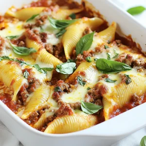 - 20 large pasta shells - 1 pound ground beef or turkey - 1 cup ricotta cheese - 1 cup shredded mozzarella cheese - ½ cup grated Parmesan cheese - 1 small onion, finely chopped - 2 cloves garlic, minced - 1 teaspoon Italian seasoning - 1 jar (24 oz) marinara sauce - Salt and pepper to taste - Fresh basil leaves for garnish (optional) Meaty stuffed shells need the right mix of ingredients. Start with the pasta shells. Choose large shells for easy filling. Ground beef or turkey adds protein and flavor. I enjoy using turkey for a lighter meal. The cheeses create a creamy filling. Ricotta makes it rich, while mozzarella adds meltiness. Parmesan gives a nice salty touch. Next, you need aromatics like onion and garlic. They bring depth to the dish. Italian seasoning addsHerbs that enhance the flavor. Marinara sauce ties it all together. Use your favorite brand or homemade sauce for the best taste. Don’t forget salt and pepper! They balance the flavors. For a final touch, fresh basil leaves look pretty and taste great. They brighten up the dish. Gather these ingredients before you start cooking. It makes the process smooth and fun. Enjoy making your meaty stuffed shells! {{ingredient_image_1}} Set your oven to 375°F (190°C). Preheating helps cook the dish evenly. Cook 20 large pasta shells as per the package instructions. Make sure they are al dente. Once cooked, drain and set them aside to cool a bit. In a large skillet over medium heat, add one finely chopped onion and two cloves of minced garlic. Sauté until the onion looks clear. Then, add one pound of ground beef or turkey. Cook until it turns brown. Drain any excess fat to keep it light. In a large bowl, mix the cooked meat with one cup of ricotta cheese, one cup of shredded mozzarella cheese, and half a cup of grated Parmesan cheese. Add one teaspoon of Italian seasoning, salt, and pepper. Stir until everything blends well. Use a spoon or a piping bag to fill each pasta shell with the meat and cheese mix. Be careful not to overfill them. Start by spreading a thin layer of marinara sauce on the bottom of your baking dish. Place the stuffed shells seam side up in the dish. Pour the remaining marinara sauce over the shells, making sure they are all covered. Add some extra mozzarella cheese on top. Cover the dish with aluminum foil and bake for 25 minutes. After that, take off the foil and bake for another 10 minutes. You want the cheese to be bubbly and golden. Once out of the oven, let the dish cool for a few minutes. If you like, add fresh basil leaves for a nice touch. Serve hot and enjoy! You can use ground beef or ground turkey for this dish. Both give great flavor. Ground beef adds richness, while ground turkey is lighter. You can even try ground chicken or plant-based meat for a twist. Each choice will change the taste a bit, so pick what you like best. After cooking the pasta shells, let them cool for a few minutes. This step helps prevent burns when you fill them. Use a spoon or a piping bag to stuff the shells. This tool makes it easy and keeps things clean. Don’t overstuff them! Fill them enough so they hold together but not too much that they burst. Cheese is key in stuffed shells. Ricotta is classic, but you can mix it up. Try adding goat cheese for tang or cottage cheese for a lighter option. You could also mix in some feta for a salty kick. For the topping, mozzarella is great, but you can use provolone or a mix of cheeses for extra flavor. Pro Tips Perfect Pasta Shells: Make sure to cook the pasta shells just until al dente. They will continue cooking in the oven, so you want them to be firm enough to hold the filling without breaking. Flavorful Filling: For an extra flavor boost, consider adding some chopped spinach or mushrooms to the meat mixture. This adds a delicious depth to your filling and increases the nutritional value. Cheese Variations: Feel free to experiment with different types of cheese in your filling. Adding some feta or goat cheese can give a tangy twist that complements the sauces beautifully. Make Ahead: You can prepare the stuffed shells ahead of time and refrigerate them before baking. Just add a few extra minutes to the baking time if they go in cold. {{image_2}} You can easily make vegetarian stuffed shells. Swap out the meat for plant-based options. Try using lentils, mushrooms, or even tofu. Each adds a unique flavor and texture. You can also load the filling with extra veggies. Spinach, zucchini, or bell peppers work great. Mix these with ricotta and mozzarella for a hearty bite. Want some heat? Add spices to your filling. Red pepper flakes or cayenne pepper can do the trick. For a fresh kick, chop up some jalapeños and mix them in. You can also top the stuffed shells with a spicy marinara sauce. Just look for sauces that say "spicy" or "arrabbiata." Your taste buds will thank you for the extra flare! If you need gluten-free options, don't worry. Many brands offer gluten-free pasta shells. Look for those made from brown rice or quinoa. They cook up just like regular pasta. You can use the same filling and sauce for a delicious meal. Your gluten-free friends will love you for it! To keep your stuffed shells fresh, store them in an airtight container. Make sure they cool down first. Place a layer of plastic wrap over the dish before sealing. This helps prevent drying out. You can keep them in the fridge for up to three days. When ready to eat, check for any signs of spoilage. Freezing stuffed shells is easy and great for future meals. First, let them cool completely. Then, place them in a single layer on a baking sheet. Freeze until they are firm, about two hours. After that, transfer them to a freezer-safe bag or container. Be sure to label them with the date. They will stay good for about three months. When reheating stuffed shells, avoid drying them out. Preheat your oven to 350°F (175°C). Place the shells in a baking dish and cover with foil. Bake for 20-25 minutes until heated through. If you want, add a splash of marinara sauce on top to keep them moist. You can also reheat in the microwave but they may not taste as good. Always check for even heating. Yes, you can prepare Meaty Stuffed Shells ahead of time. You can assemble the dish, then cover it tightly. Keep it in the fridge for up to 24 hours before baking. If you want to freeze it, wrap it well in plastic wrap and foil. It can last for up to three months in the freezer. To bake, just add a few extra minutes to the cooking time if frozen. You can tell when the stuffed shells are done by looking for a few signs. The cheese on top should be bubbly and golden. The sauce should be hot and steaming. Also, when you insert a knife into the center, it should feel warm. Use a food thermometer; it should read 165°F (74°C) in the center. Meaty Stuffed Shells pair well with several sides. A fresh green salad adds a nice crunch. Garlic bread is great for scooping up sauce. Roasted vegetables can bring extra flavor. You might also enjoy steamed broccoli or a light pasta salad. Each side balances the rich flavors of the shells. Definitely! You can mix in different ingredients to make your filling special. Try adding spinach or mushrooms for extra veggies. You can use chicken or sausage instead of beef or turkey. Herbs like parsley or oregano can add fresh notes. Even different cheeses like goat cheese or feta can change the flavor profile. If you need a ricotta substitute, there are good options. Cottage cheese is a great choice; it has a similar texture. Cream cheese can work too, but it has a richer taste. For a lighter option, try Greek yogurt. You can even make a homemade version by blending tofu with a bit of lemon juice for a dairy-free choice. This blog post detailed a tasty recipe for stuffed pasta shells. We covered all the ingredients, from large pasta shells to flavorful ground beef, and even some tasty cheese options. I shared tips for cooking and stuffing the shells with ease. You learned about delicious variations and how to store leftovers. Overall, stuffed shells are a great meal choice. They are fun to make and loved by many. Try this recipe, and enjoy every bite!