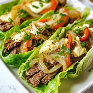 For these tasty roll-ups, you need simple, fresh ingredients. Here’s what you’ll need: - 1 lb thinly sliced beef steak (sirloin or ribeye works great) - 1 medium green bell pepper, sliced - 1 medium onion, sliced - 8 oz cream cheese, softened - 1 cup shredded mozzarella cheese - 8 large lettuce leaves (romaine or butter lettuce) These ingredients make the dish rich and filling, while keeping it low-carb. Seasonings bring out the best flavors in your roll-ups. Use: - 1 teaspoon garlic powder - 1 teaspoon onion powder - Salt and pepper to taste These spices add depth and enhance the taste of the beef and veggies. Choosing the right lettuce is key for the perfect wrap. I recommend: - Romaine lettuce for a crunchy texture - Butter lettuce for a softer bite Both options hold the filling well and add freshness to each roll-up. {{ingredient_image_1}} First, grab a skillet and set it over medium heat. Pour in 2 tablespoons of olive oil. Once the oil is hot, add the sliced onion and green bell pepper. Stir them gently. Sauté until they soften and turn a bit brown, about 5-7 minutes. Add 1 teaspoon of garlic powder, 1 teaspoon of onion powder, salt, and pepper to taste. Mix well and then remove the veggies from the skillet. Set them aside on a plate. Now, use the same skillet for cooking the steak. Add the thinly sliced beef steak to the pan. Cook for about 3-5 minutes, stirring often. You want it to brown nicely. Once done, season lightly with salt and pepper. This adds great flavor to the meat. In a medium bowl, combine 8 oz of softened cream cheese with 1 cup of shredded mozzarella cheese. Use a spatula to mix them together. You want a creamy, smooth texture. This mixture will add richness to your roll-ups. Lay out a large lettuce leaf on a clean surface. Spread a generous layer of the cheese mixture over the leaf. Next, add some of the sautéed vegetables on top. Then, place a portion of the cooked steak. Roll the lettuce tightly from the base to the tip, similar to a burrito. Repeat this process with the remaining ingredients. Your Keto Philly Cheesesteak Roll Ups are now ready to serve! When making Keto Philly Cheesesteak Roll Ups, the cut of beef matters. I like using sirloin or ribeye. These cuts are tender and have great flavor. They cook quickly and stay juicy. Avoid tougher cuts, as they may not be as enjoyable. Look for beef that is thinly sliced. This helps it cook evenly and blends well with the other ingredients. Sautéing the vegetables is a key step. Start with a hot skillet and add olive oil. This gives the veggies a nice sear. Cook the onions and bell peppers until soft. This usually takes about 5-7 minutes. Stir them often to prevent burning. Adding garlic powder and onion powder enhances the taste. Season with salt and pepper, but don’t overdo it. You want the beef to shine through. Keep your roll ups fresh by storing them in an airtight container. They last about three days in the fridge. To reheat, place them in a skillet over low heat. This warms them without making them soggy. You can also use a microwave, but be careful not to overcook them. Enjoy these tasty roll ups for lunch or dinner anytime! Pro Tips Choose the Right Meat: Opt for well-marbled cuts like ribeye for extra flavor and tenderness. Prep Ingredients Ahead: Pre-slicing the vegetables and beef can save time during cooking. Use Fresh Herbs: Garnishing with fresh herbs like parsley or basil can elevate the flavor profile of your dish. Experiment with Cheeses: Try different cheese blends like provolone or gouda for a unique twist on the classic flavor. {{image_2}} You can change the cheese in your Keto Philly Cheesesteak Roll Ups to fit your taste. Cream cheese makes it creamy, but you can use other cheeses too. Try provolone for a sharper flavor, or gouda for a smoky twist. Cheddar adds a nice bite. Each cheese brings its unique taste. Mix and match to find your favorite. Feel free to add more veggies to your roll ups. Mushrooms add a nice earthiness, while spinach can boost nutrients. You can also try jalapeños for a kick. Just sauté them with the onions and peppers. This not only adds flavor but also makes your meal more colorful and healthy. If you like heat, add hot peppers. Slice fresh jalapeños or use pickled ones. Add them to the sautéed veggies for a spicy punch. You can also sprinkle red pepper flakes on the cheese mixture. This change will give your roll ups an exciting twist. Adjust the heat to match your taste! To keep your Keto Philly Cheesesteak Roll Ups fresh, store them in the fridge. Use an airtight container to prevent them from drying out. Line the bottom with a paper towel to absorb any excess moisture. This helps keep the roll-ups crisp and tasty for longer. Freezing is a great option if you want to save some roll-ups for later. Wrap each roll-up tightly in plastic wrap. Then, place them in a freezer bag. Make sure to remove as much air as possible. This way, they won't get freezer burn. When you're ready to eat them, thaw in the fridge overnight before reheating. In the fridge, the roll-ups can last up to three days. If you freeze them, they can stay good for about three months. After this time, the quality may drop, but they will still be safe to eat. Check for any off smells or changes in texture before consuming. If you need a cream cheese substitute, try ricotta or cottage cheese. Both work well. You can also use vegan cream cheese for a dairy-free option. Just remember to adjust the texture and flavor to match the dish. Yes, you can use different meats for these roll-ups. Chicken, turkey, or pork all taste great. Just slice your meat thinly. Cook it the same way you would with beef. Each meat will bring its own flavor to the dish. To make these roll-ups dairy-free, skip the cream cheese and mozzarella. Use dairy-free cheese or avocado instead. You can also add hummus for creaminess. This keeps the dish rich while staying dairy-free. Making Keto Philly Cheesesteak Roll Ups is simple and fun. You learned about key ingredients and seasonings, plus suggested lettuce types. I shared steps for sautéing vegetables, cooking steak, and preparing cheese. You now know tips for choosing beef cuts and perfecting your sautéing. Explore variations with different cheeses or veggies to suit your taste. Remember, proper storage keeps your roll ups fresh and tasty. Enjoy crafting this delicious treat anytime!