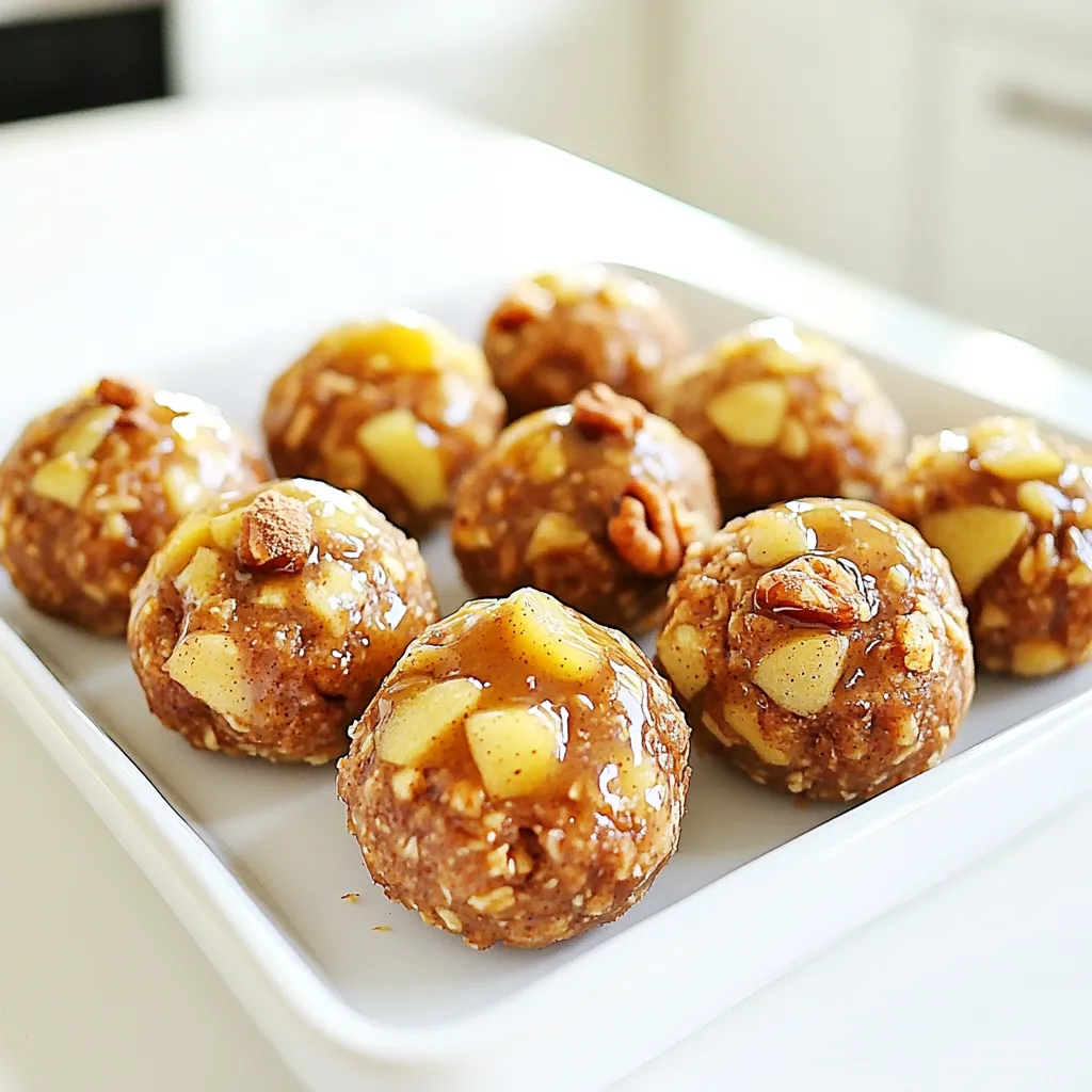 To make No Bake Apple Pie Energy Bites, you need: - 1 cup rolled oats - 1/2 cup almond butter (or peanut butter) - 1/3 cup honey (or maple syrup for vegan option) - 1 teaspoon vanilla extract - 1 teaspoon cinnamon - 1/4 teaspoon nutmeg - 1/2 cup dried apple pieces, chopped - 1/3 cup walnuts, chopped (optional) - Pinch of salt You can swap almond butter for peanut butter if you prefer. Maple syrup works well instead of honey for a vegan treat. For a nut-free option, use sunflower seed butter. If you want a little crunch, add more walnuts or even some pumpkin seeds. You can also try using different dried fruits like raisins or cranberries instead of apples. These bites offer great health perks. Rolled oats provide fiber, which aids digestion. Almond butter adds healthy fats and protein, giving you energy. Honey or maple syrup gives natural sweetness without refined sugars. Cinnamon and nutmeg not only add flavor but also have anti-inflammatory properties. The dried apples bring vitamins and minerals, while walnuts contribute omega-3 fatty acids for heart health. To start, grab a large mixing bowl. Combine 1 cup of rolled oats, 1/2 cup of almond butter, and 1/3 cup of honey. Add 1 teaspoon of vanilla extract for flavor. Mix these until they blend well and look smooth. Next, sprinkle in 1 teaspoon of cinnamon, 1/4 teaspoon of nutmeg, and a pinch of salt. Stir again to make sure the spices are mixed in well. Now, it’s time to add 1/2 cup of chopped dried apple pieces. If you want some crunch, add 1/3 cup of chopped walnuts. Fold these into the mixture, spreading them evenly throughout. This step is fun and lets you see all the tasty bits! To get the best mix, use a sturdy spatula or spoon. If the mixture feels too dry, add a little more almond butter or honey. This will help hold everything together. Make sure to mix until all the oats are coated. You want to see the apples and nuts spread evenly. If you see dry spots, keep stirring. If you prefer a smoother texture, you can blend the oats in a food processor first. This will make the bites softer. Just remember not to over-blend; you still want some texture. Once your mixture is ready, it’s time to form the bites. Use your hands to scoop out small portions, about 1 inch in diameter. Roll these into balls; this is where the fun happens! Place the rolled bites on a parchment-lined baking sheet or plate. After you have rolled all the bites, put them in the fridge. Let them chill for at least 30 minutes. This helps them firm up. Once they’re set, store them in an airtight container. They will stay fresh in the fridge for up to a week. If you want to keep them longer, pop them in the freezer. Enjoy your tasty, healthy snack! You can easily change the taste of your energy bites. Try adding different spices like ginger or cardamom. For a nutty twist, use sunflower seed butter instead of almond butter. If you want a crunch, toss in some seeds like pumpkin or chia. You can also swap in dried fruits, like cranberries or raisins, for a new flavor. These energy bites are great for many occasions. Pack them for school lunch or take them to work. They make a quick breakfast or a sweet treat after dinner. You can even serve them on a platter at parties. For a fun twist, drizzle some melted chocolate on top before serving. Mixing too much can make the bites dry. Just blend until everything is combined. If you don’t chill the bites long enough, they may fall apart. Make sure to refrigerate for at least 30 minutes. Lastly, don’t skip the salt. It enhances all the flavors and makes them pop! {{image_2}} You can switch up the nut butter for a new taste. Almond butter gives a smooth flavor. Peanut butter adds a rich, nutty taste. For a nut-free option, try sunflower seed butter. Each choice brings its own fun twist to the energy bites. Want to boost the nutrition? Add a scoop of protein powder. Vanilla or unflavored work best. This change makes your bites a better post-workout snack. It also helps keep you full longer. Just mix the protein powder with the dry ingredients first. If you need a gluten-free snack, use certified gluten-free oats. This way, you can enjoy these bites safely. You can also swap honey with maple syrup for a vegan option. Both keep the bites tasty and healthy, so you don’t miss out. To keep your no bake apple pie energy bites fresh, store them in an airtight container. Place them in the fridge right after they firm up. This helps maintain their texture and flavor. If you use a glass container, it can add extra freshness. You can freeze these energy bites for long-term storage. First, place them in a single layer on a baking sheet. Freeze them for about an hour. Once they are firm, transfer them to a freezer-safe bag or container. Be sure to label it with the date. These energy bites last about one week in the fridge. If you freeze them, they can last up to three months. Just remember to thaw them in the fridge before enjoying. This way, they stay chewy and tasty. Using fresh apples is not the best choice. Fresh apples have more water content. This can make the bites too wet. Dried apples add chewy texture and concentrated flavor. I recommend sticking to dried apples for the best taste. These energy bites can last about one week in the fridge. Store them in an airtight container. For longer storage, freeze them. They can stay fresh in the freezer for up to three months. Yes, these no-bake bites are perfect for kids. They are easy to make and fun to eat. The flavors are sweet and familiar. Plus, they make a great snack for after school or playtime. If you want a different sweetener, try using maple syrup. This option is great for a vegan diet. You can also use agave nectar if you prefer. Each of these options will still give you that sweet taste. This guide covered the key ingredients and steps for making energy bites. You learned about important ingredients, health benefits, and tasty substitutes. I shared tips for mixing, rolling, and storing bites properly. You can customize flavors and avoid common mistakes with ease. With these insights, you can create energy bites that taste great and fit your needs. Enjoy experimenting and making them your own!